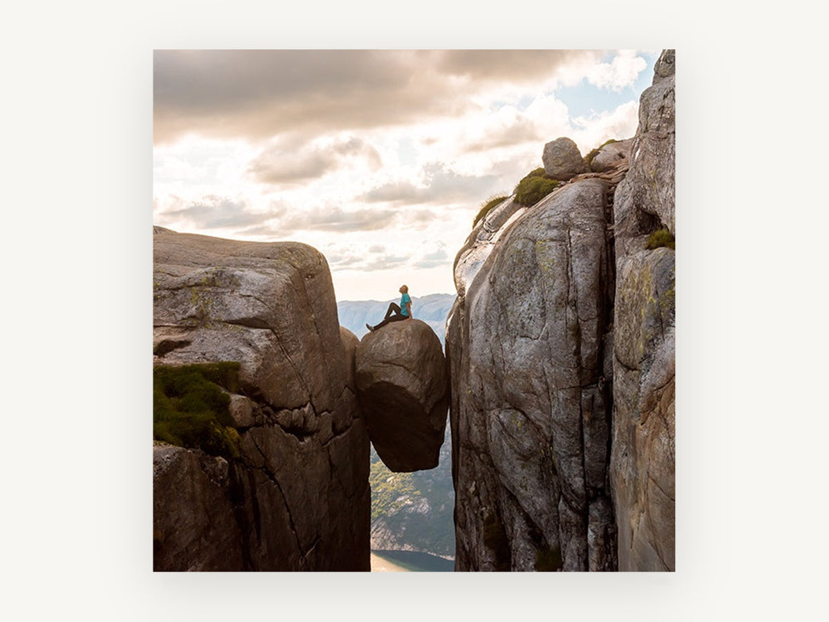 Boulder in the Gap, person sitting on wedged boulder photograph, landscape canvas wall art print, front view