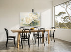 Powder Blue Rose Haze floral canvas print on the wall of a dining room