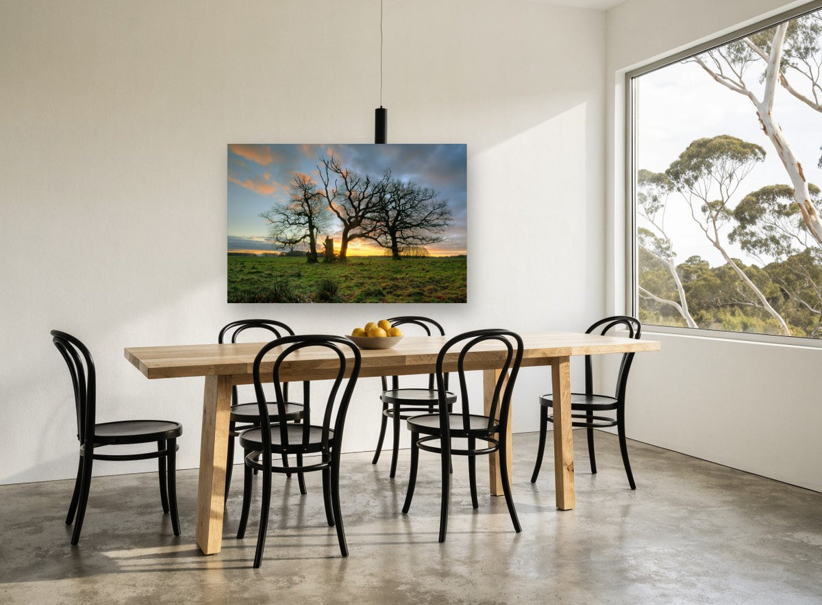 Three Oaks at Dusk landscape canvas print on the wall of a dining room