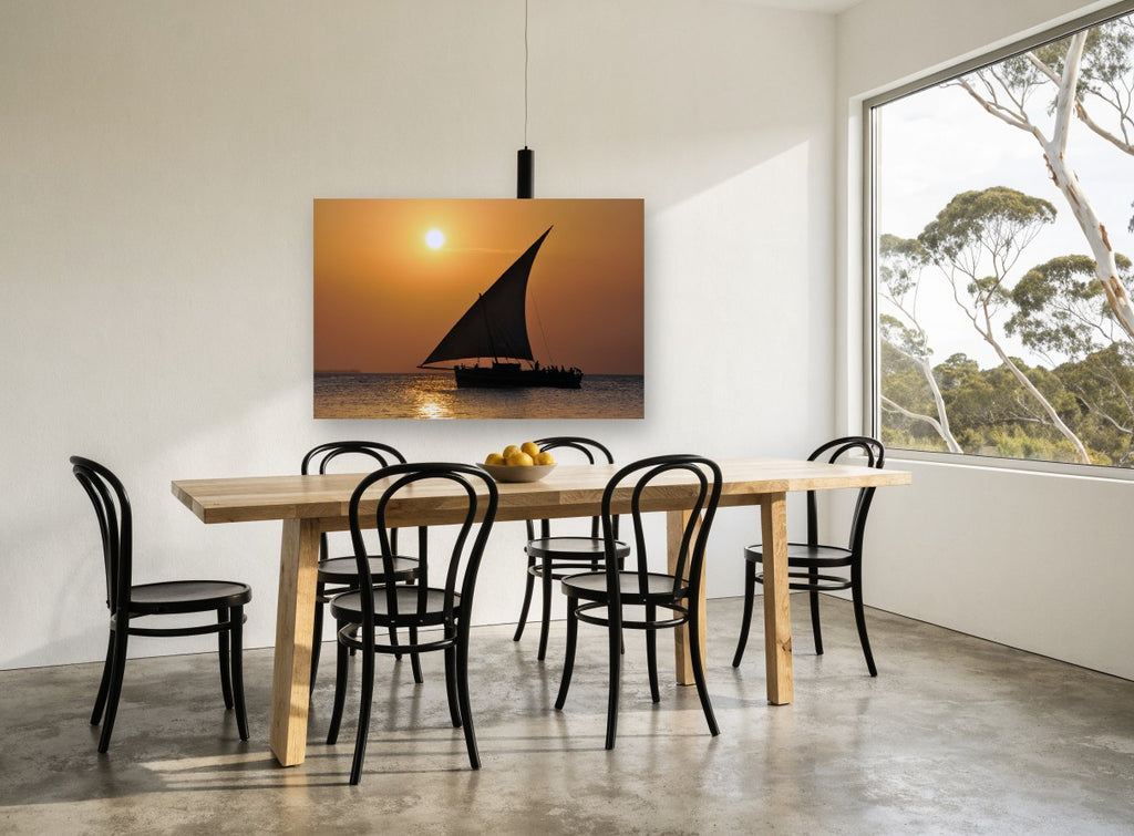 Dhow at Amber Dusk coastal canvas print on the wall of a dining room