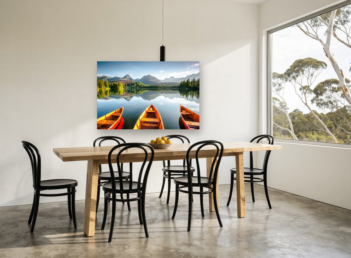 Three Boats Alpine Lake landscape canvas print on the wall of a dining room