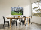 Almond Orchard in Bloom floral canvas print on the wall of a dining room