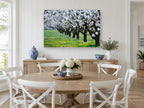 Almond Orchard in Bloom floral canvas print on the wall of a Hamptons dining room