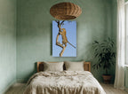 Leopard Up The Branch animal canvas print on the wall of a bedroom