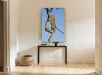 Leopard Up The Branch animal canvas print on the wall of a hallway
