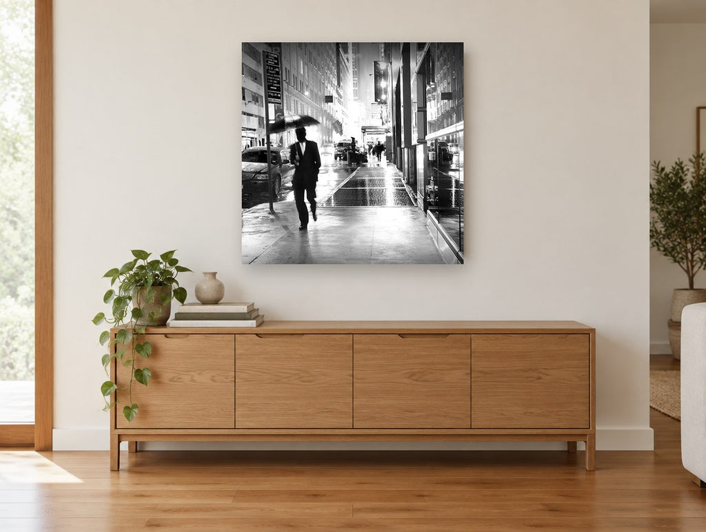 Rainy Night Walk city canvas print on the wall of a living room above a sideboard