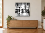 Rainy Night Walk city canvas print on the wall of a living room above a sideboard