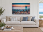 Pebble Shore Afterglow coastal canvas print on the wall of a beach house living room