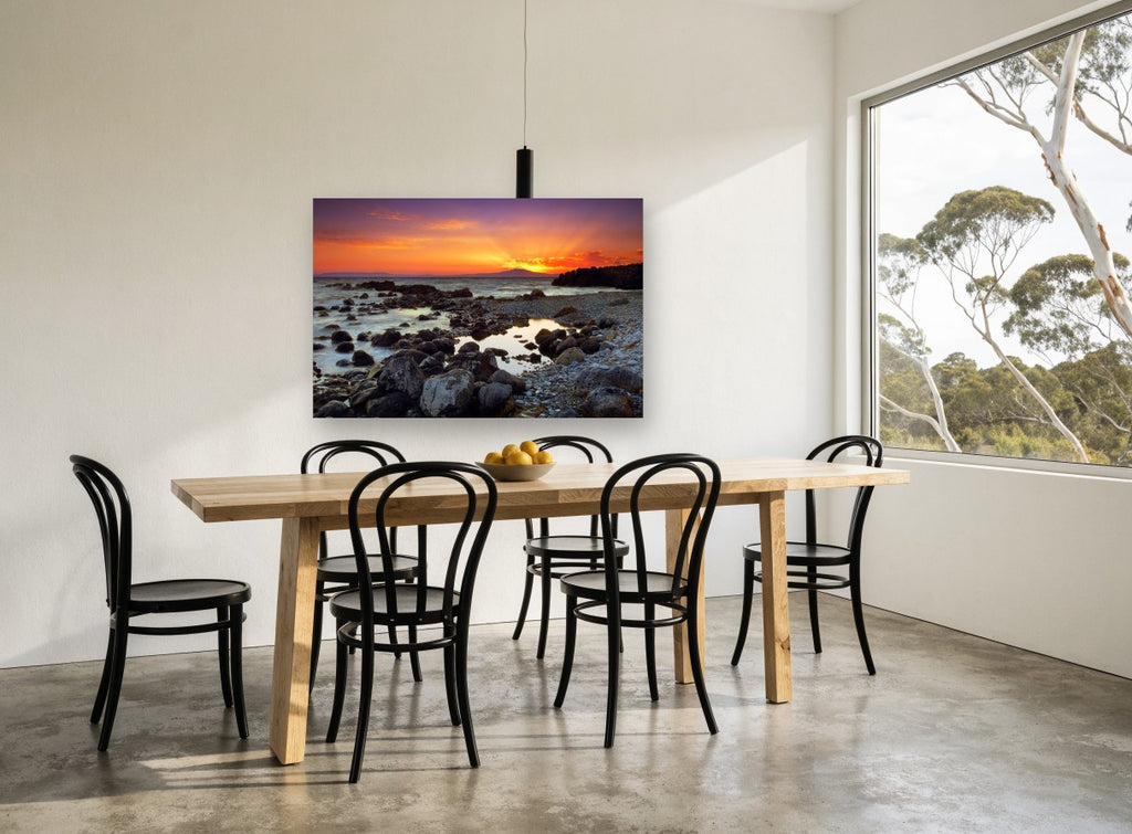 Mani Sunset Shore coastal canvas print on the wall of a dining room