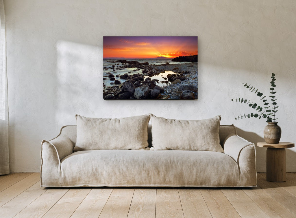 Mani Sunset Shore coastal canvas print on the wall of a living room