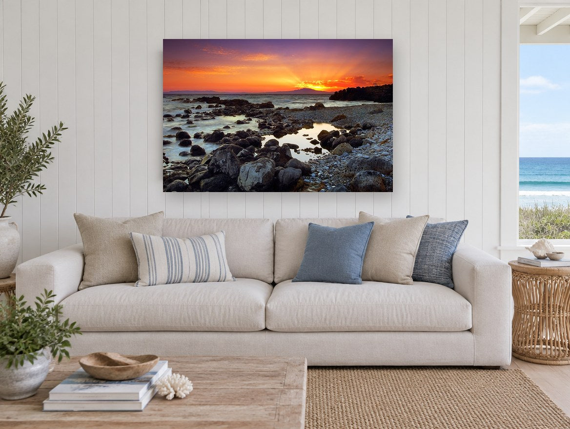 Mani Sunset Shore coastal canvas print on the wall of a beach house living room