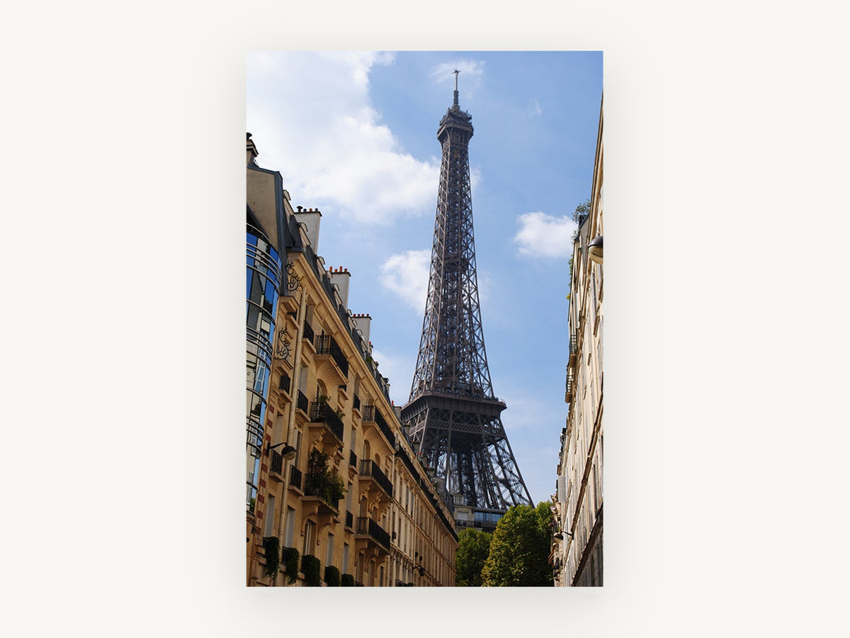 Eiffel Above the Rooftops, eiffel tower between paris buildings photograph, city canvas wall art print, front view
