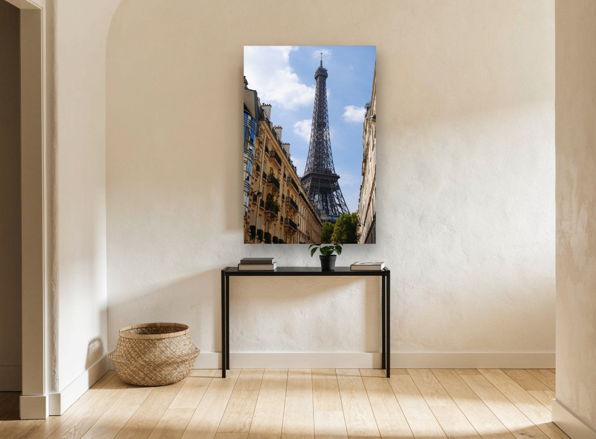 Eiffel Above the Rooftops city canvas print on the wall of a hallway