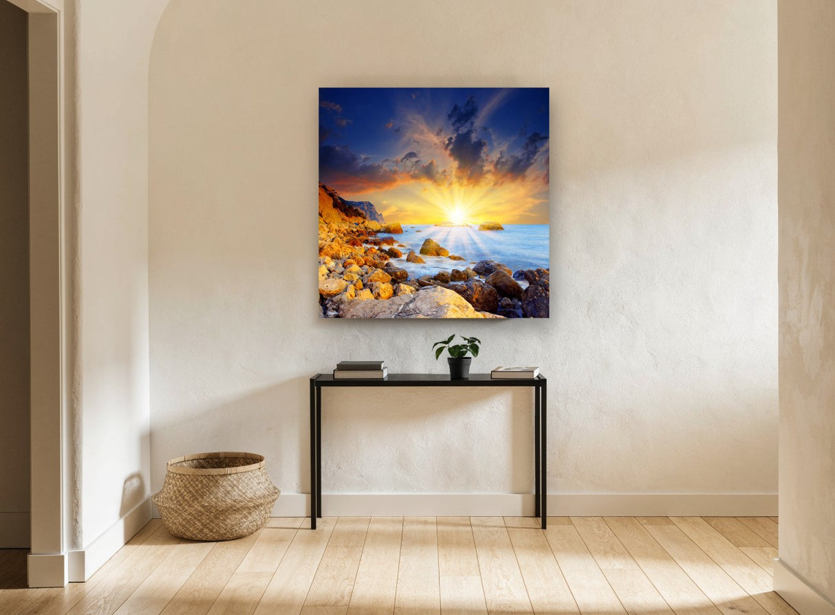 Sunburst Over Rocky Shore coastal canvas print on the wall of a hallway