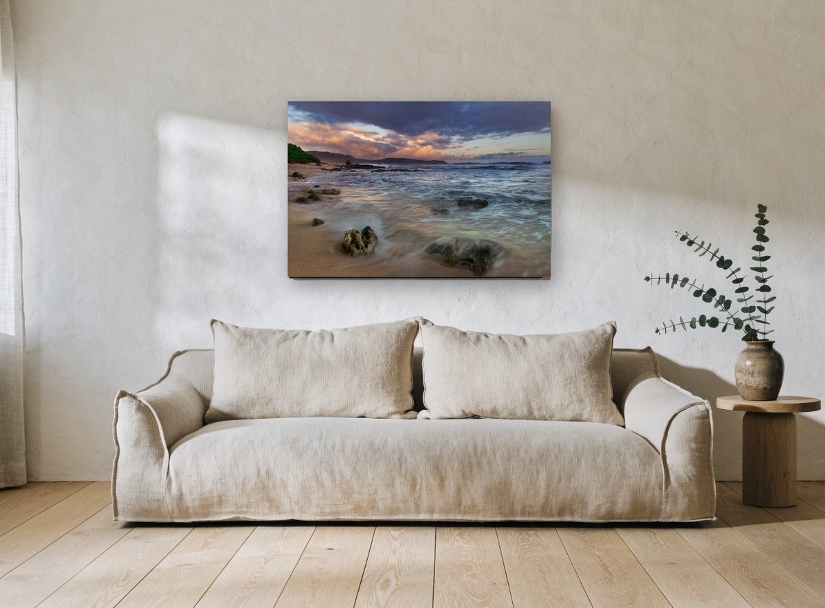 Dusk Surge Over Rocks coastal canvas print on the wall of a living room