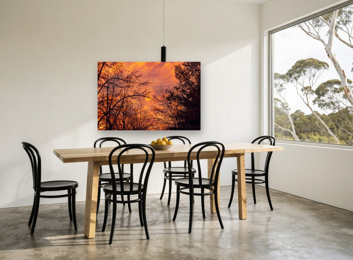 Ember Sky Silhouettes landscape canvas print on the wall of a dining room