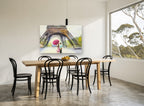 Umbrella Under the Tower floral canvas print on the wall of a dining room