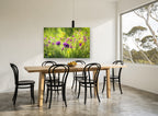 Meadow Thistle Glow floral canvas print on the wall of a dining room