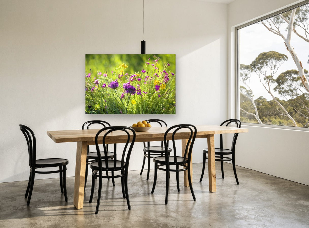 Meadow Thistle Glow floral canvas print on the wall of a dining room