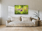 Meadow Thistle Glow floral canvas print on the wall of a living room