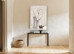 Bare Branches in White floral canvas print on the wall of a hallway