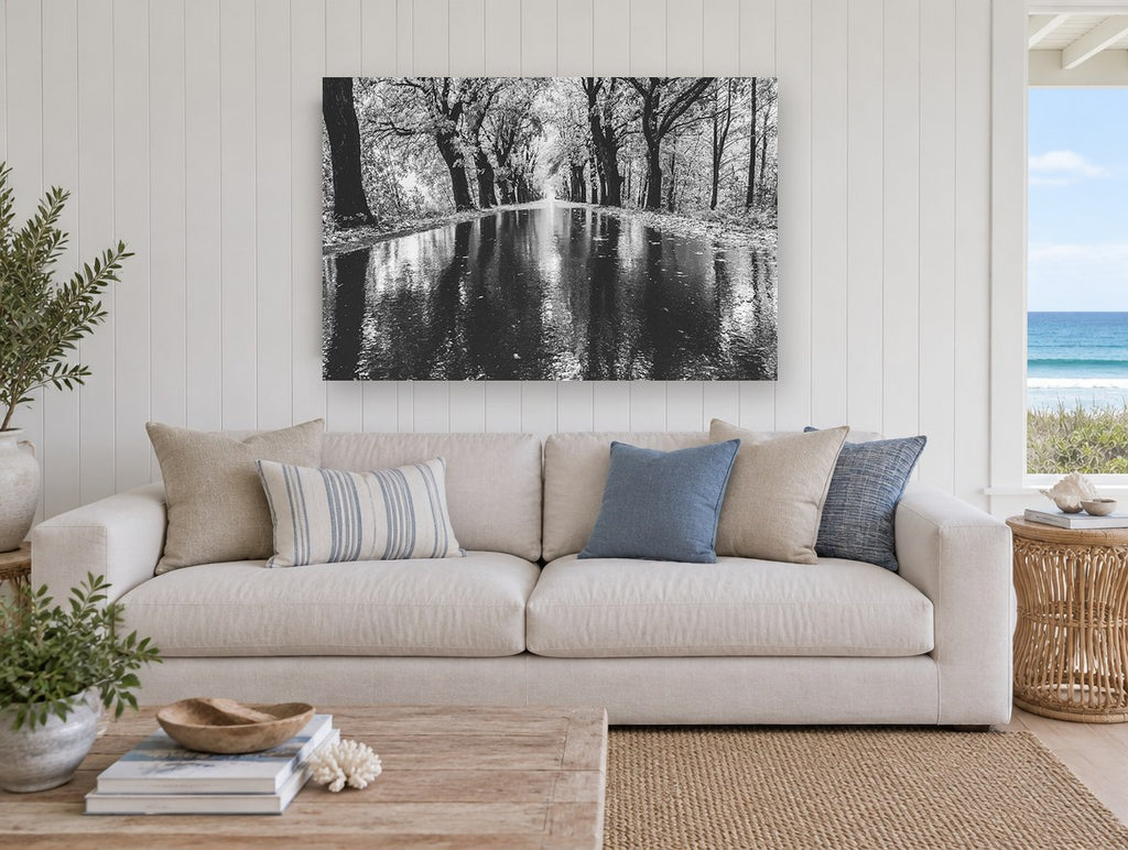 Rain Along the Avenue landscape canvas print on the wall of a beach house living room
