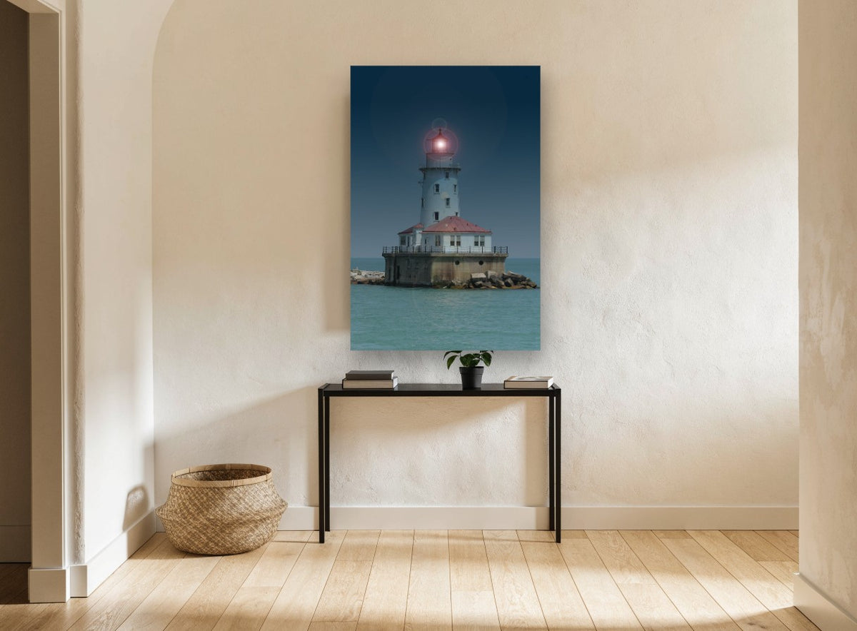 Glowing Harbour Light coastal canvas print on the wall of a hallway