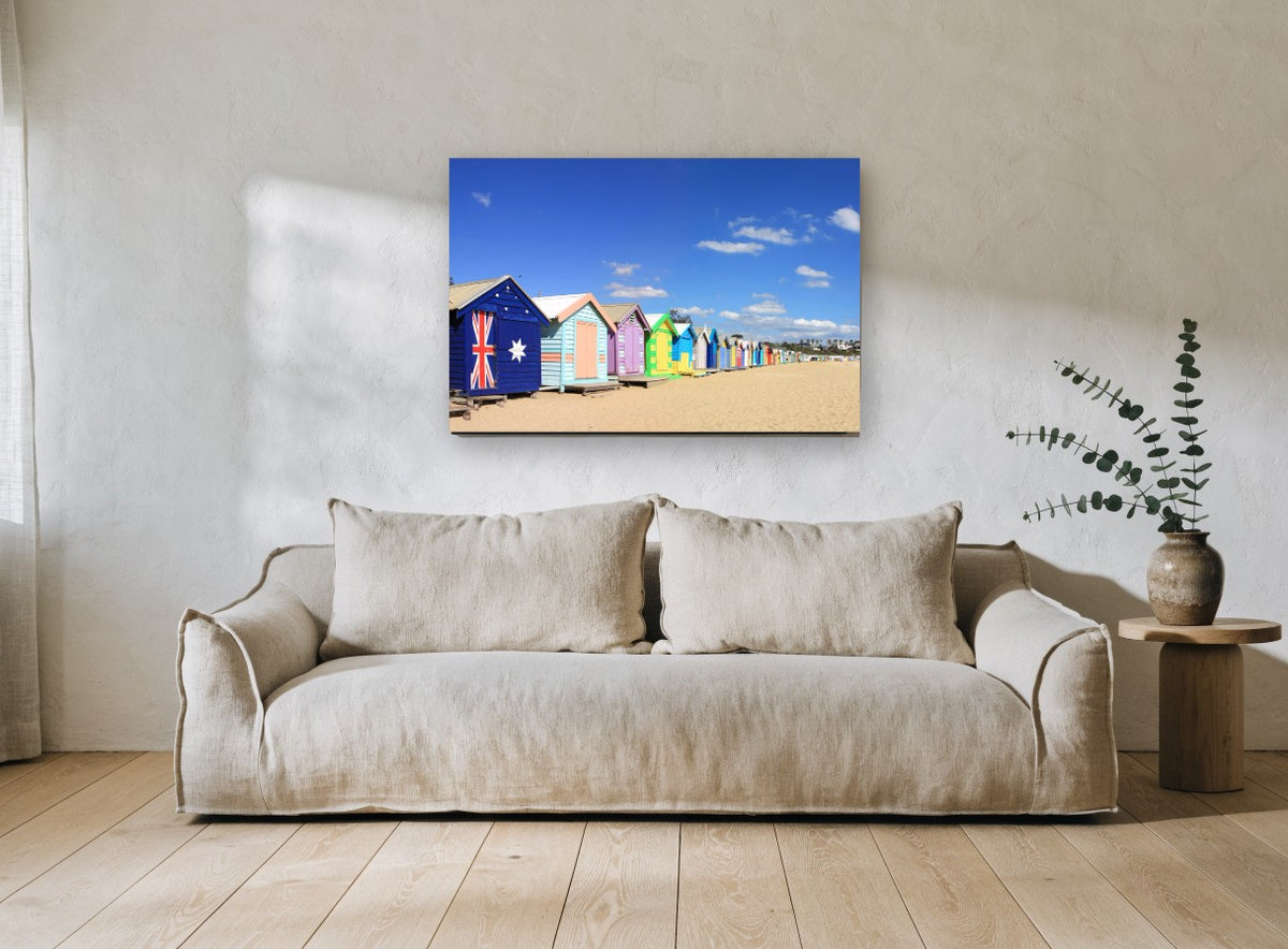 Flag Hut Beach Row coastal canvas print on the wall of a living room