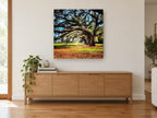 Arching Oak Avenue floral canvas print on the wall of a living room above a sideboard
