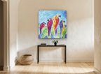 Four Parrots on a Branch animal canvas print on the wall of a hallway