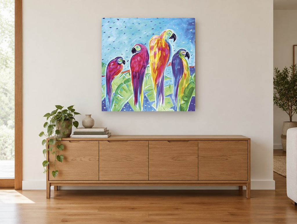 Four Parrots on a Branch animal canvas print on the wall of a living room above a sideboard