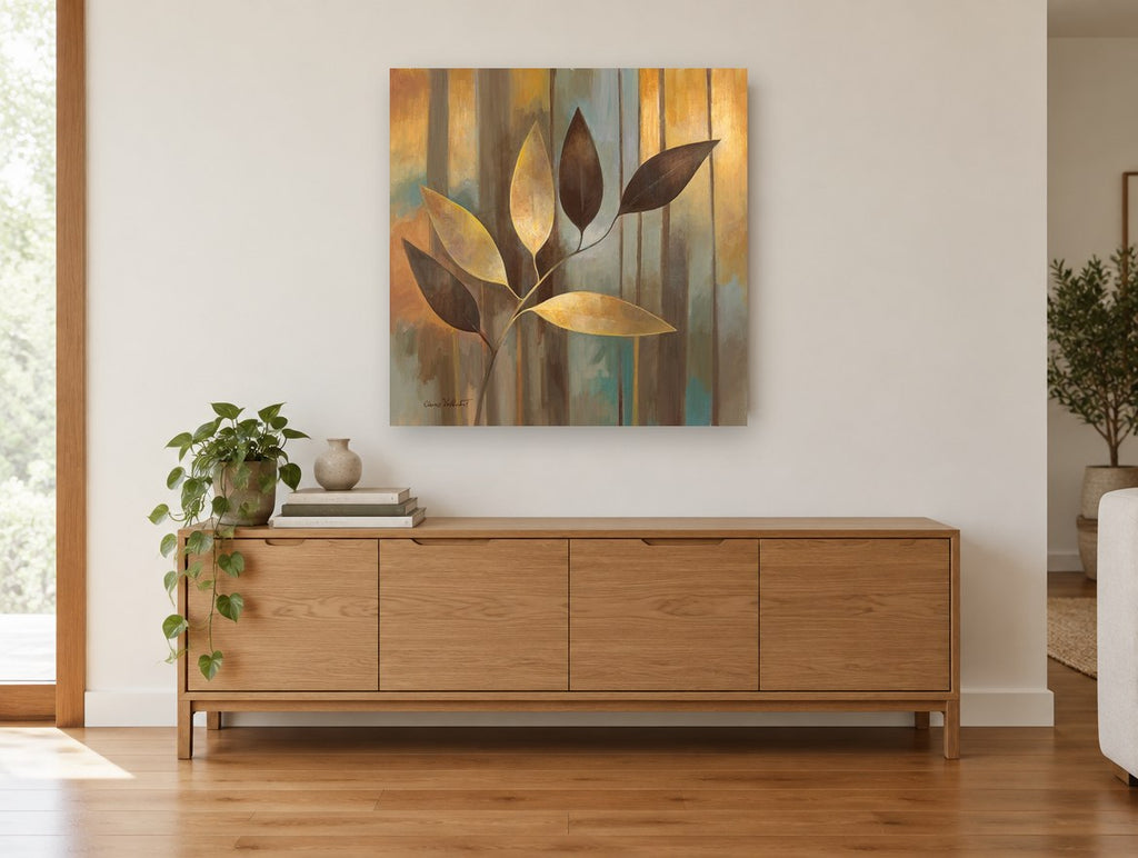 Golden Leaf Spray floral canvas print on the wall of a living room above a sideboard