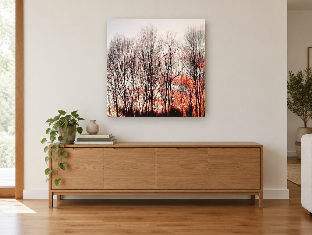 Bare Trees at Dusk floral canvas print on the wall of a living room above a sideboard