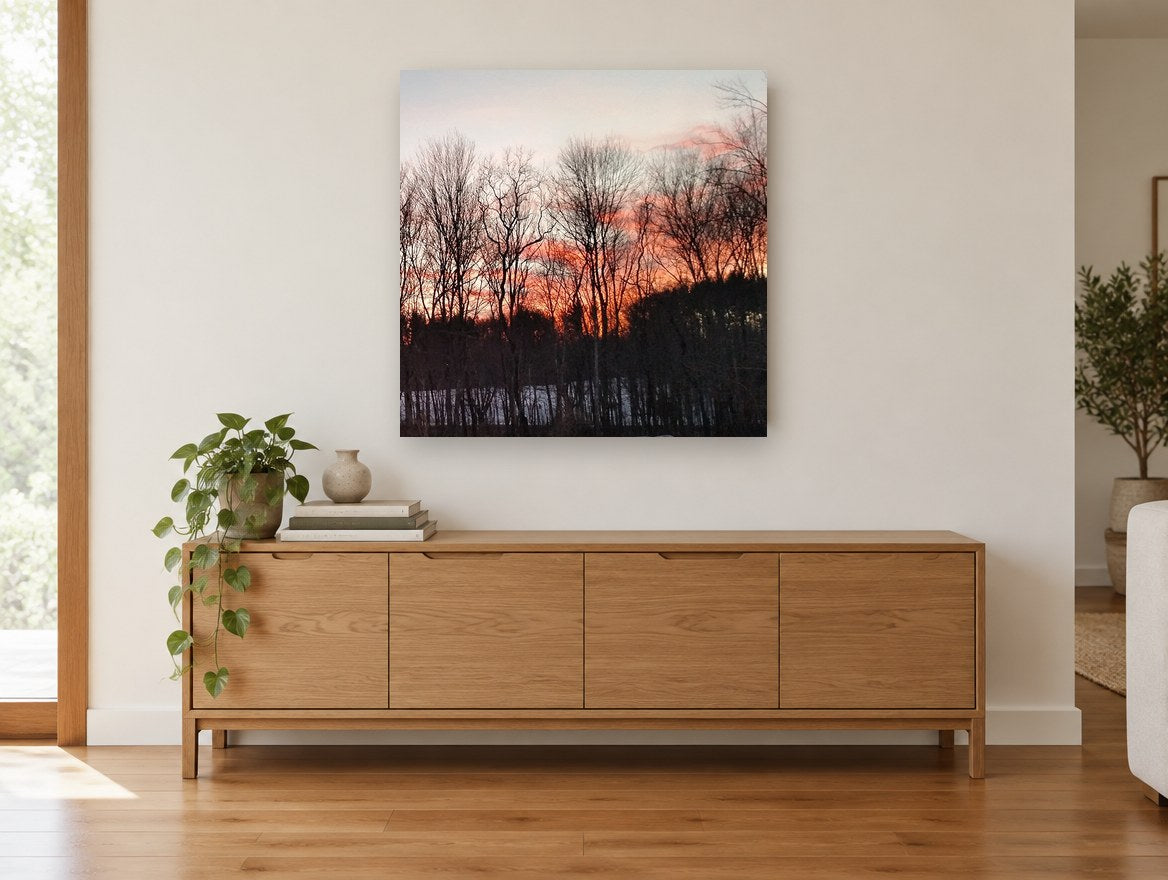 Winter Trees at Dusk floral canvas print on the wall of a living room above a sideboard