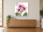 Pink Orchid Glow floral canvas print on the wall of a living room above a sideboard