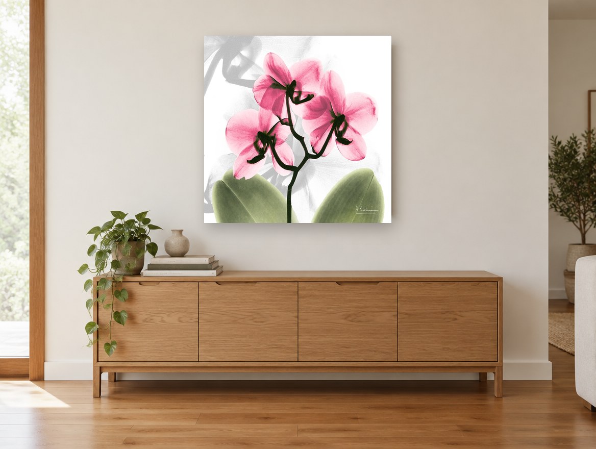 Pink Orchid Glow floral canvas print on the wall of a living room above a sideboard