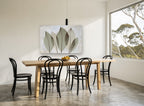 Translucent Sage Leaves floral canvas print on the wall of a dining room