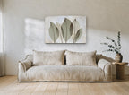 Translucent Sage Leaves floral canvas print on the wall of a living room