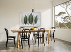 Six Sage Leaves floral canvas print on the wall of a dining room
