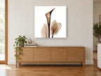 Sepia Calla Veil floral canvas print on the wall of a living room above a sideboard
