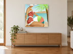 Polka Dot Beach Day coastal canvas print on the wall of a living room above a sideboard