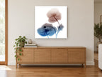 Twin Poppies in Rust and Blue floral canvas print on the wall of a living room above a sideboard