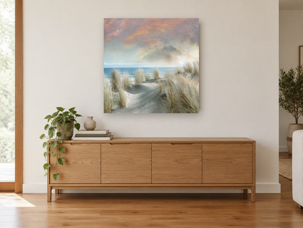 Dune Grass Dawn coastal canvas print on the wall of a living room above a sideboard