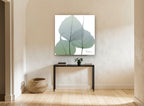 Sage Leaf Veils floral canvas print on the wall of a hallway