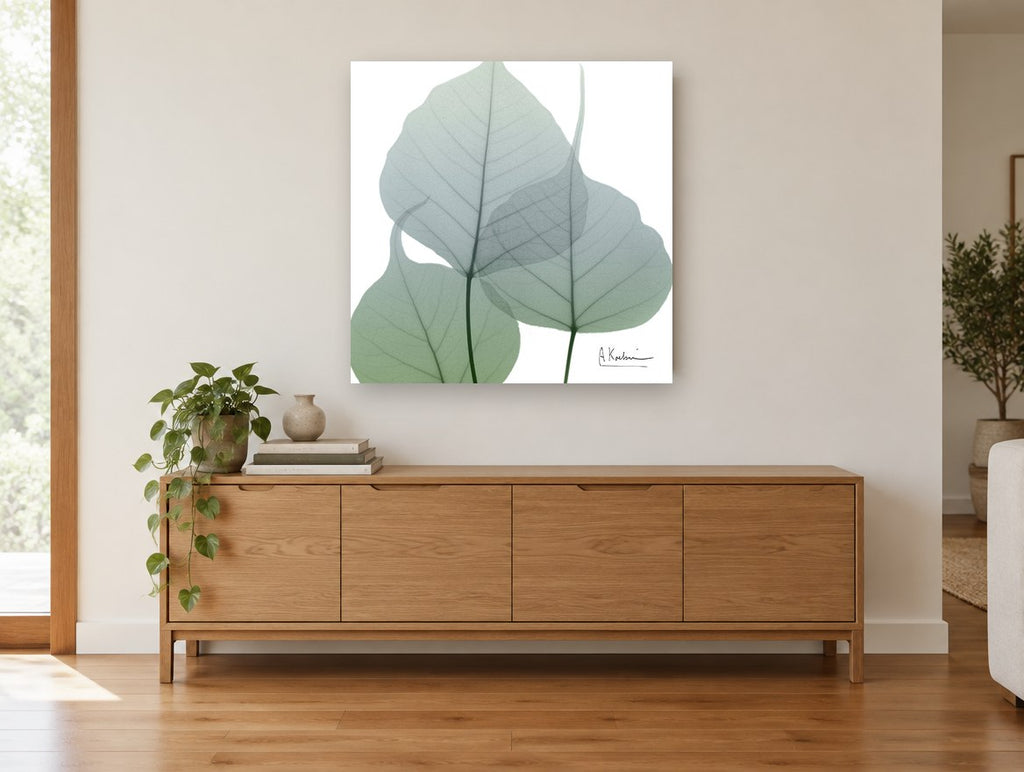 Sage Leaf Veils floral canvas print on the wall of a living room above a sideboard