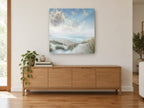 Soft Dune Horizon coastal canvas print on the wall of a living room above a sideboard