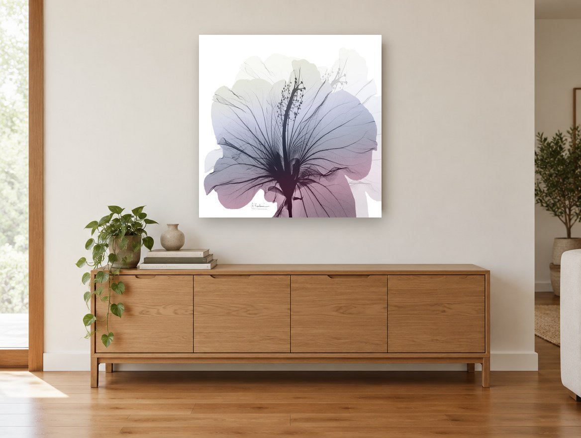 Hibiscus in Dusk Light floral canvas print on the wall of a living room above a sideboard