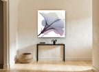 Misted Hibiscus Bloom floral canvas print on the wall of a hallway