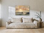 Golden Light Over Waves coastal canvas print on the wall of a living room