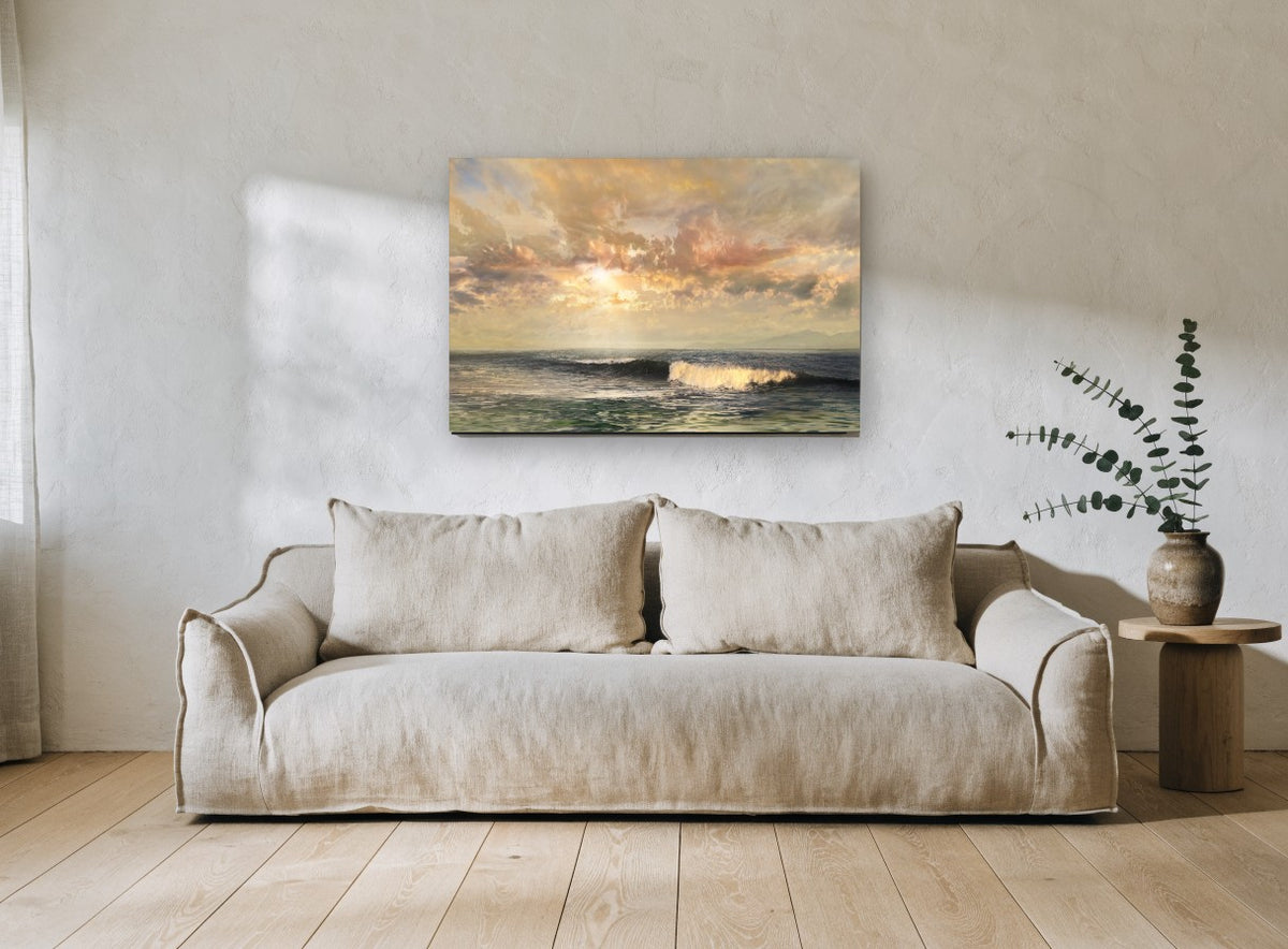 Golden Light Over Waves coastal canvas print on the wall of a living room